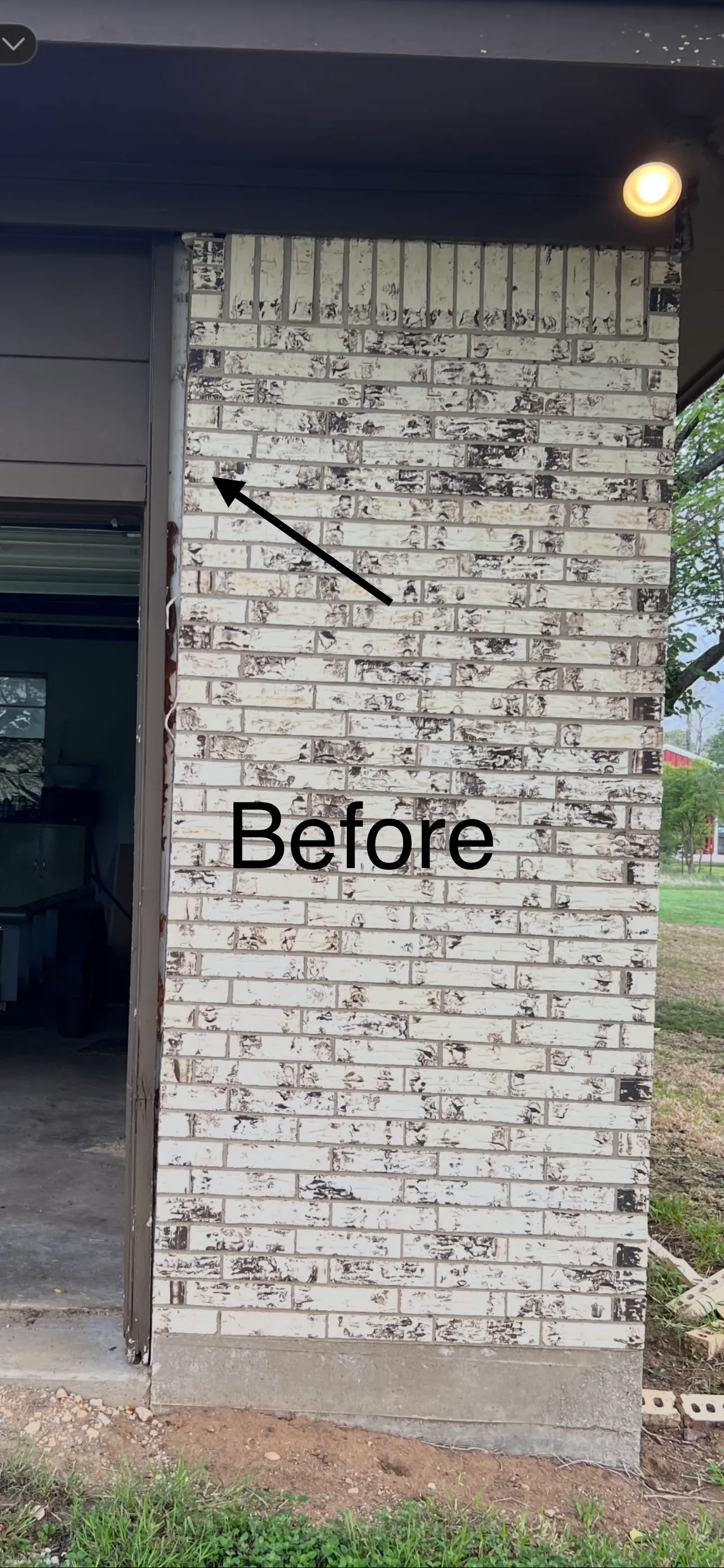White brick pulling away at a garage corner before A-Custom Foundation Repair