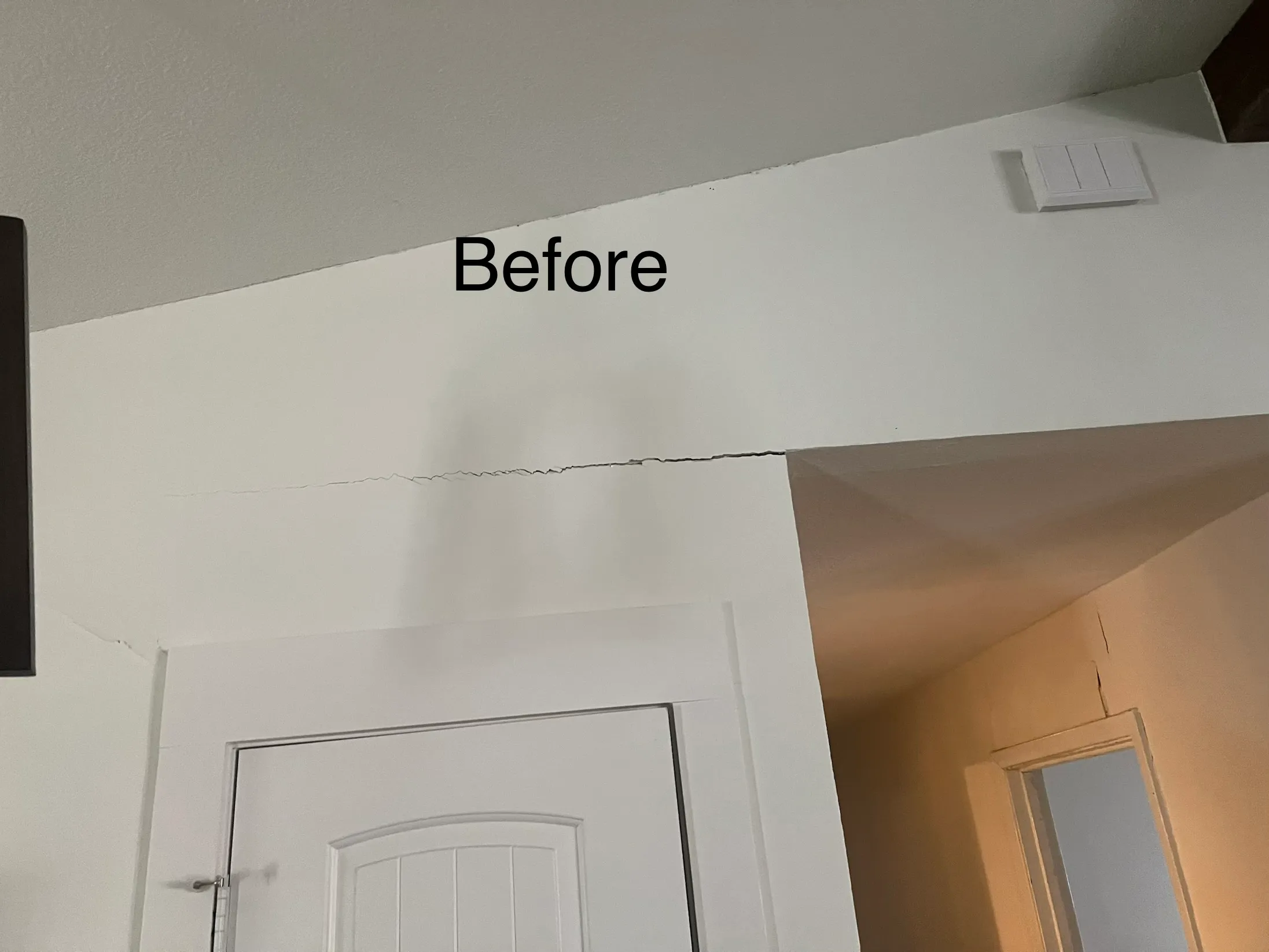 Crack spreading above an interior doorway before foundation repair